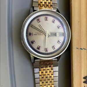 Timex silver watch with gold and silver band. Great for collectors is vintage.